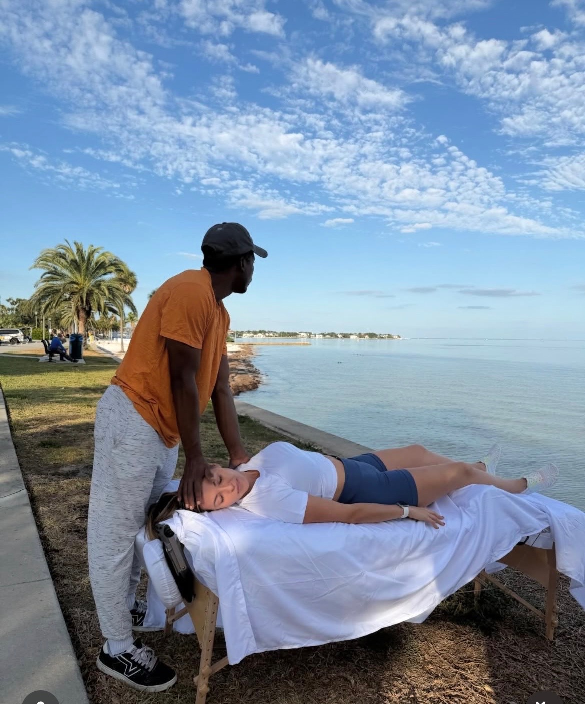 Luke Stokes performing mobile massage at the St. Petersburg waterfront