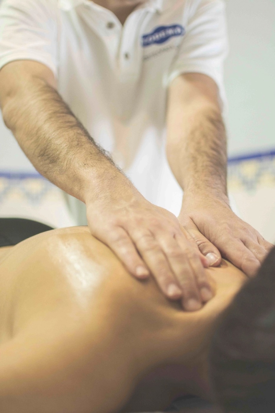 Therapist treating a client's lower back