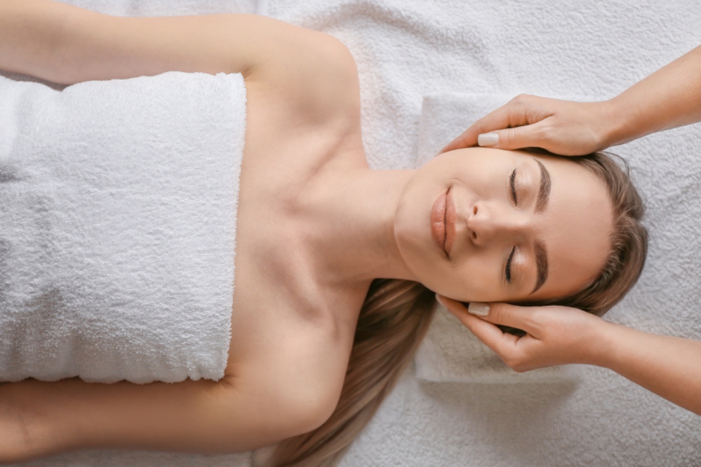 Therapist relieving head and temple tension